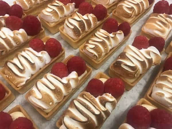 raspberry cheesecakes on plate