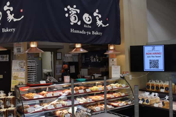 display case of breads, desserts, and pastries at Costa Mesa Store