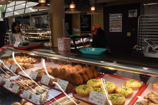 display case of breads, desserts, and pastries at Costa Mesa Store