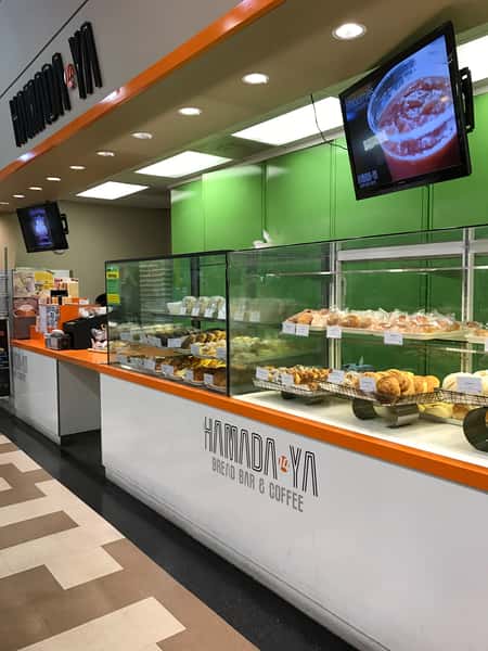 display case of breads, pastries, & desserts