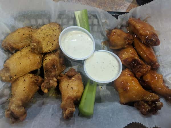 assortment of chicken wings with dipping sauce