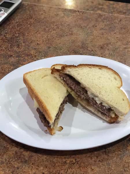 beef sandwich sliced on a dish
