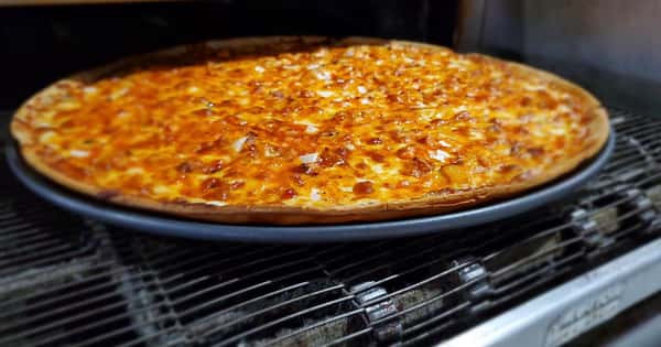 cheese pizza on a stove top