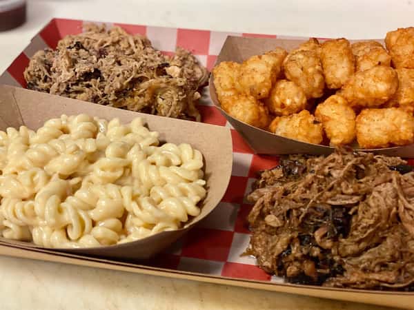 an assortment of bbq dishes on a tray