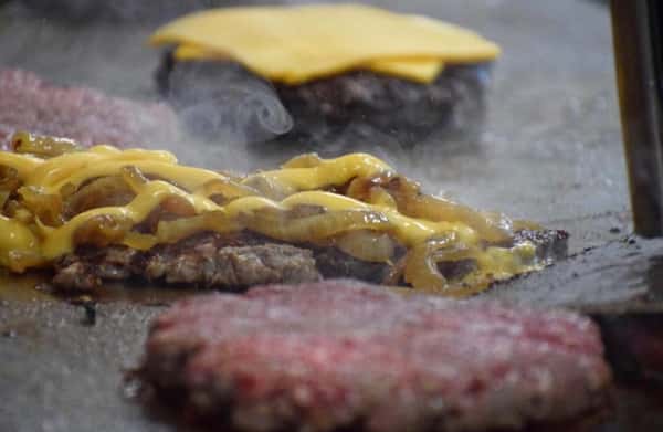 burgers cooking on grill