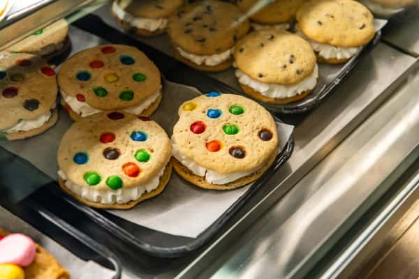 A tray of freshly baked M&M cookies and cookie sandwiches at The Butcher Shop bakery