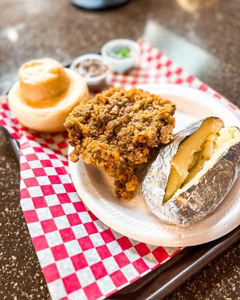 chicken, baked potato and sides