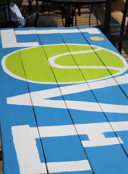 Outside dining table that has LOVE painted on it