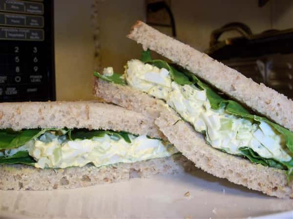 egg salad sandwich with lettuce on a plate
