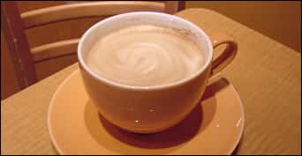 hot latte with swirling foam