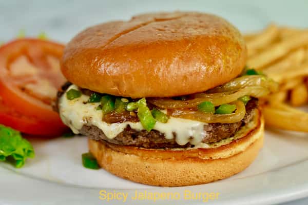 Spicy Jalapeño Burger with grilled onions, fresh jalapeños, melted jack cheese, our housemade aioli, on brioche bun