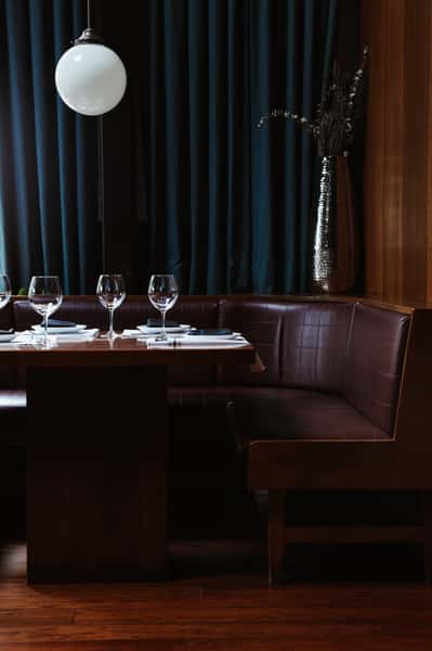 Leather circle booth with plated table