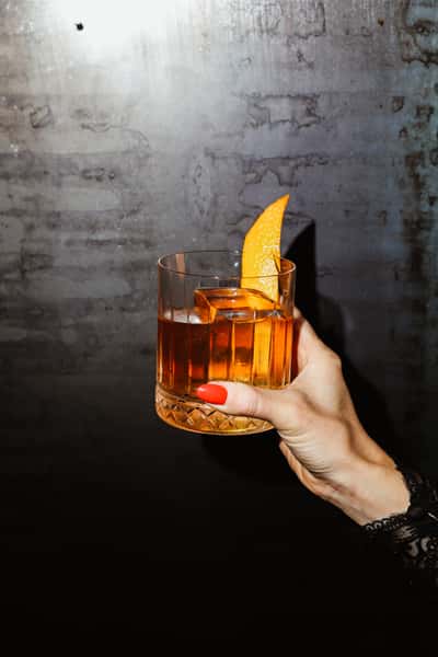 Bourbon with orange wedge