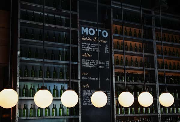 Wine and liquor storage with chalkboard drink menu