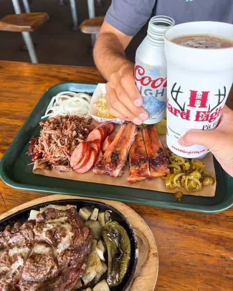 Cheers over a tray of BBQ
