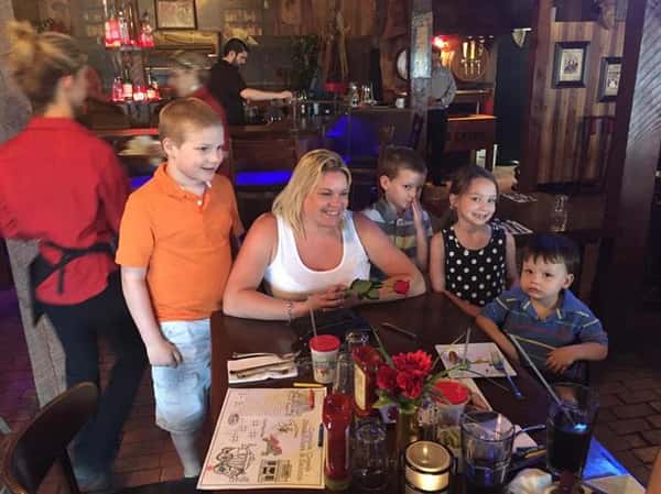 people sitting at table enjoying a meal