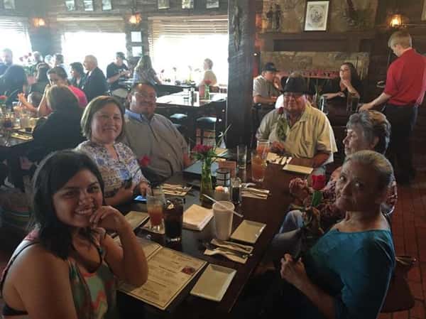 people sitting at table enjoying a meal