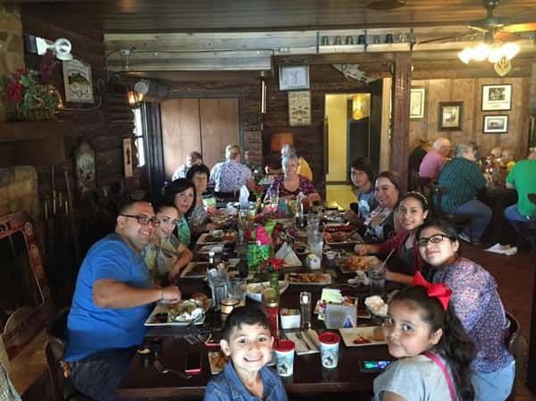 people sitting at table enjoying a meal