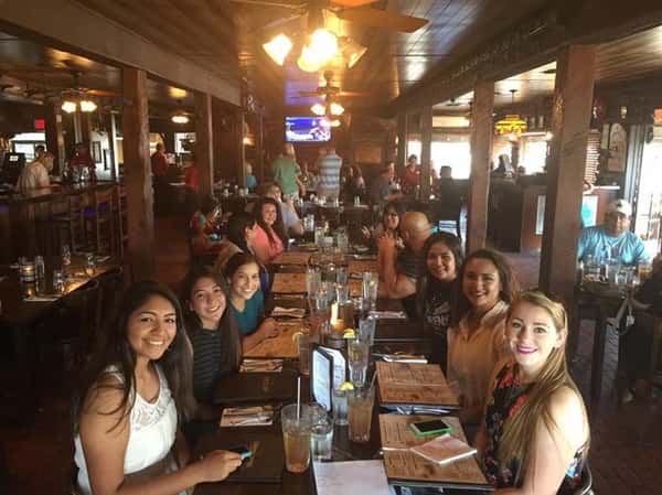 people sitting at table enjoying a meal