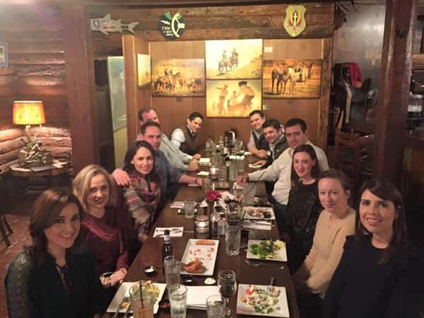 people sitting at table enjoying a meal