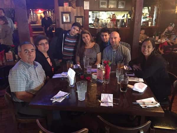 people sitting at table enjoying a meal