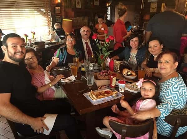 people sitting at table enjoying a meal