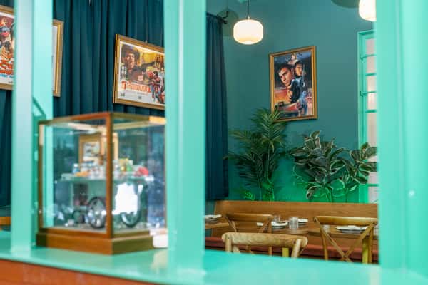 Interior of restaurant with tables laid and large windows