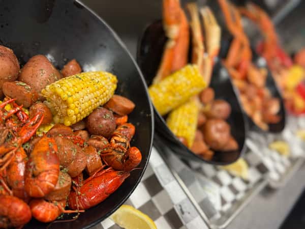 1lb Crawfish with a 1/2 lb Sausage, Corn and Potatoes with Drawn butter and old bay seasonings.