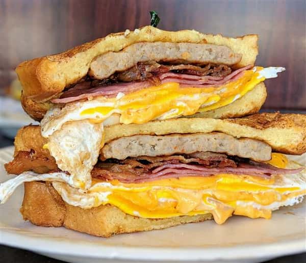 Sausage, ham, bacon, and egg breakfast sandwich