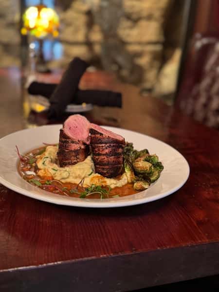 pork tenderloin on mashed potatoes