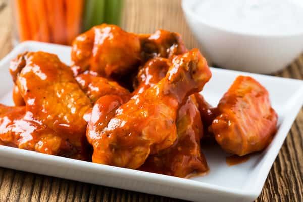 Chicken wings tossed in a sauce