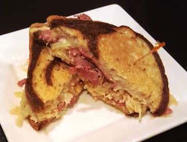 The Classic Reuben. A generous portion of freshly sliced corned beef, Swiss cheese, sauerkraut, 1000 island on rye bread.