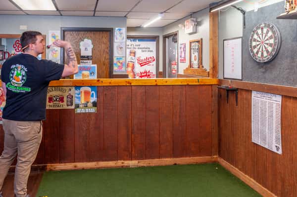guy throwing darts