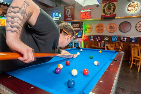 guy playing pool