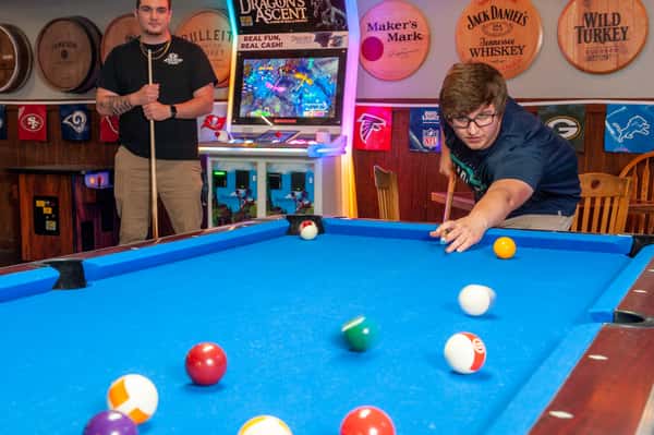 guy playing pool
