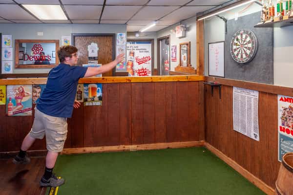 guy throwing darts