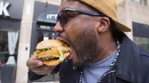 guy eating burger
