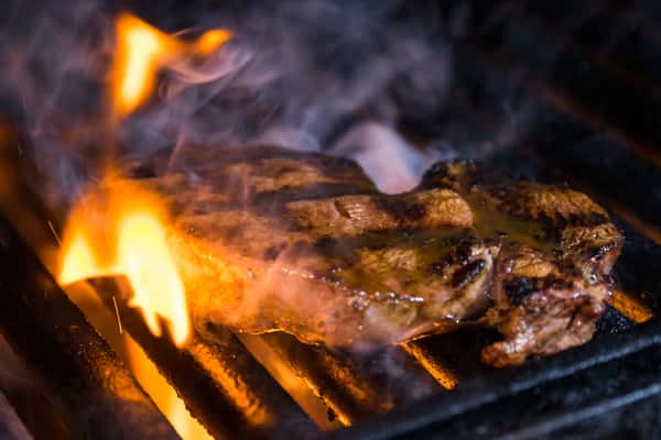 Steak on a grill steaming