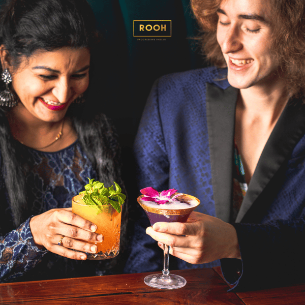 people enjoying drinks at rooh