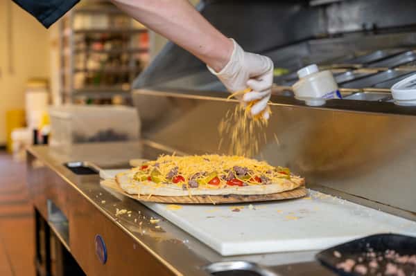 chef making pizza