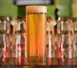 tall light beer filled pint glass