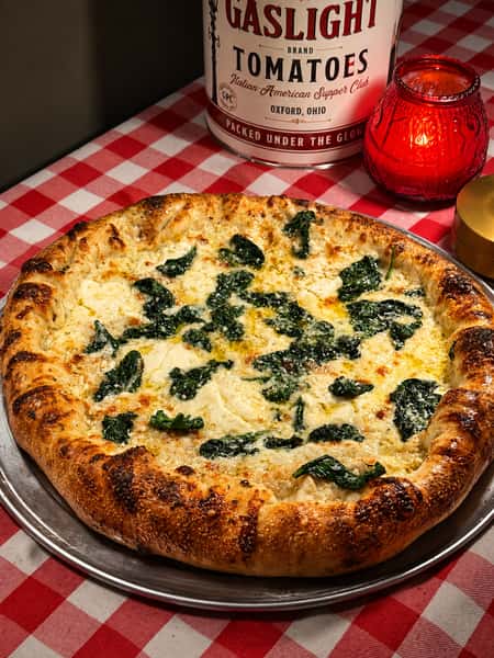 In for a change then try this one! Starts off with a lemon zest olive oil base, lots of our three cheese blend, whipped ricotta, and wilted spinach. YUM!
