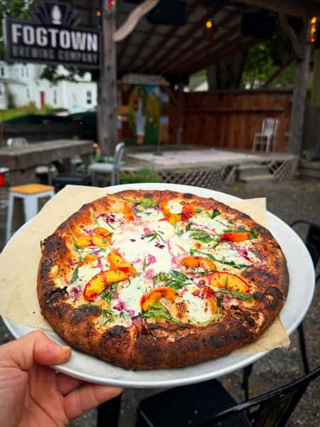 Peach Special is here! 🍑

Now that @fogtown_jon ‘s young peach trees are finally starting to ripen, we’re so excited to share this pizza special with you!

Maine-grown arugula, ricotta, pancetta & burrata. Finished with fresh rosemary from the Beer Garden and an enchanting house reduction of choke-berries from our Aronia bushes. 

Available until all the peaches are gone.