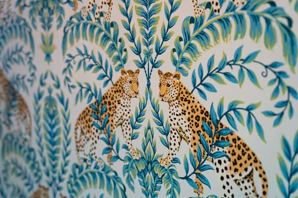 Blue foilage surround leopards mural
