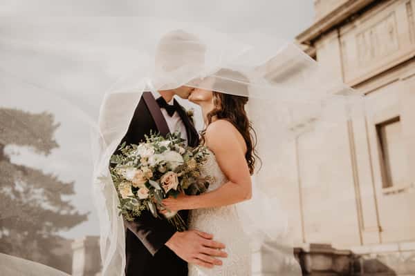 newly married couple kissing