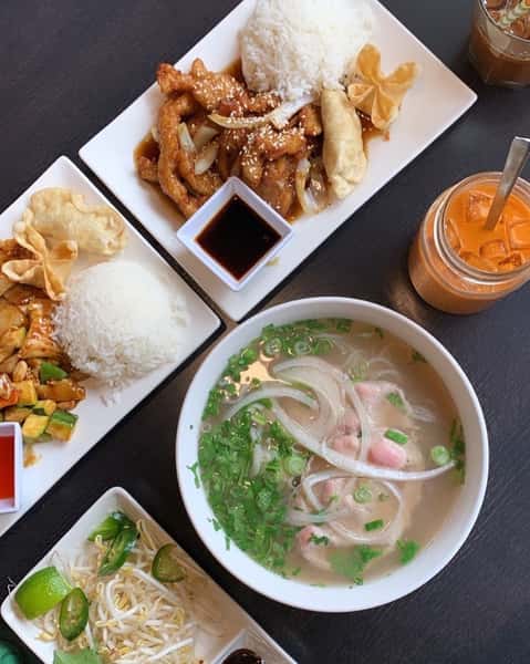Saucy asian meals on plates and in a bowl
