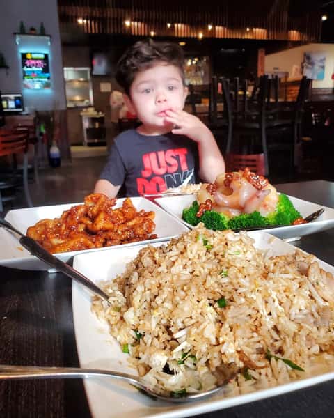 A child seated for his meal