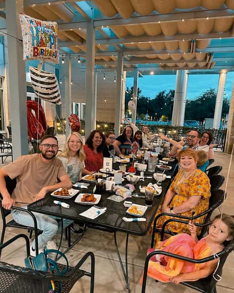 A happy event taking place in the open patio of the restaurant