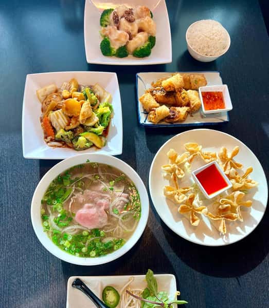 Table laid out with Asian flavored meals