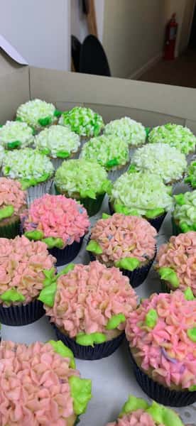 Vibrant pink, green, and white hydrangea-style cupcakes from Mural City Cakes - Cafe & Catering.